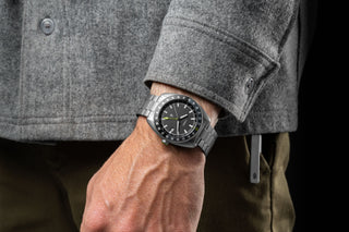 The Timex × The James Brand Automatic GMT watch on a man's wrist.